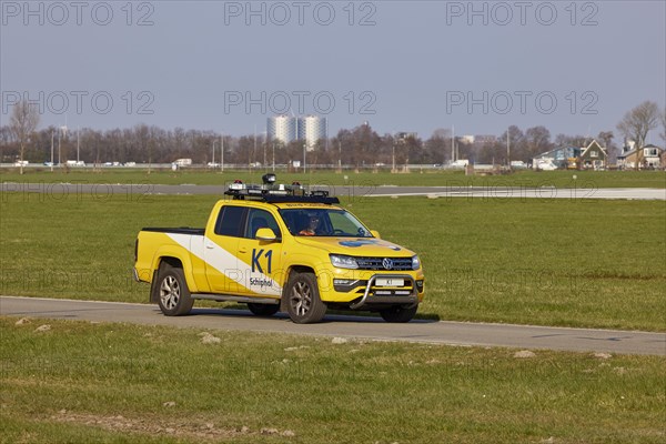 Bird Control Vehicle K1 patrolling the Polderbaan, Amsterdam Schiphol Airport in Vijfhuizen, municipality of Haarlemmermeer, Noord-Holland, Netherlands