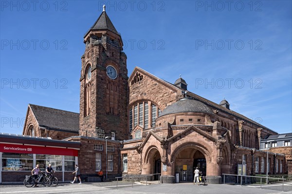 Historic Wilhelmine railway station, clock tower, pavilion with entrance to the station building, neo-Romanesque and Art Nouveau, red sandstone, cultural monument, listed building, Giessen, Giessen, Hesse, Germany, Europe