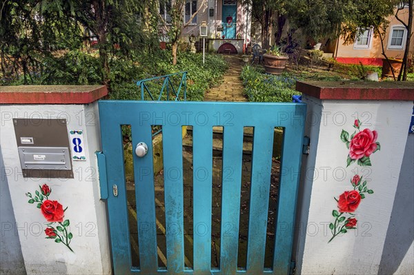 Cyan-coloured garden gate of an old villa, Kempten, Allgaeu, Bavaria, Germany, Europe