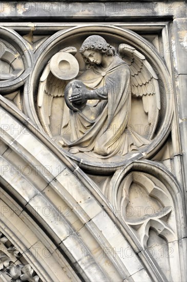 St Peter's Church, parish church, start of construction 1310, Moenckebergstrasse, angel sculpture with gentle facial expression and outstretched wings in a relief, Hamburg, Hanseatic City of Hamburg, Germany, Europe