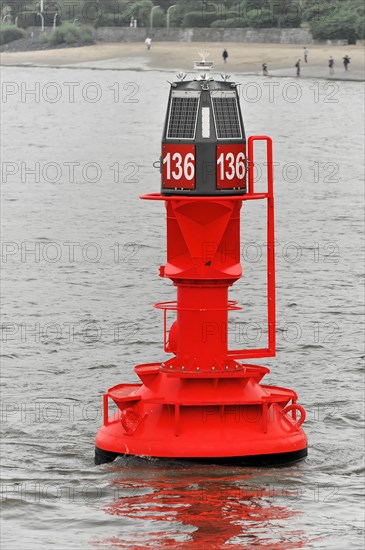 A red buoy on the water with solar panels and the number 136, Hamburg, Hanseatic City of Hamburg, Germany, Europe