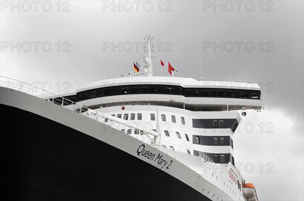 Close-up of the bridge of the Queen Mary 2 with waving flags, Hamburg, Hanseatic City of Hamburg, Germany, Europe