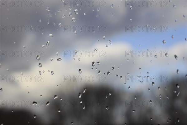 Raindrops on a window pane, North Rhine-Westphalia, Germany, Europe