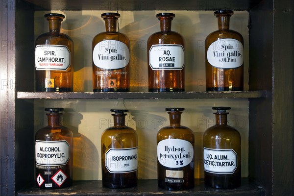 Glass jars with ingredients for medicines stand on a shelf in the historic Berg-Apotheke pharmacy in Clausthal-Zellerfeld, which was built in 1674 and is one of the oldest pharmacy buildings in Germany, 09 November 2015