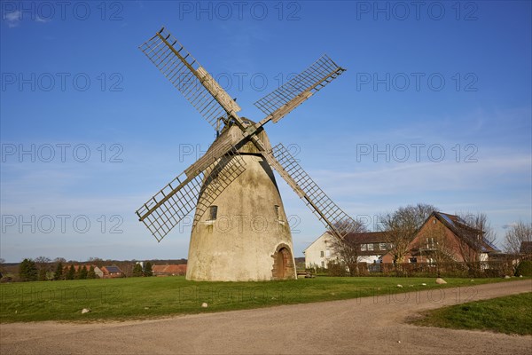 Windmill Auf der Hoechte under a cloudless blue sky is part of the Westphalian Mill Road in Hille, Muehlenkreis Minden-Luebbecke, North Rhine-Westphalia, Germany, Europe