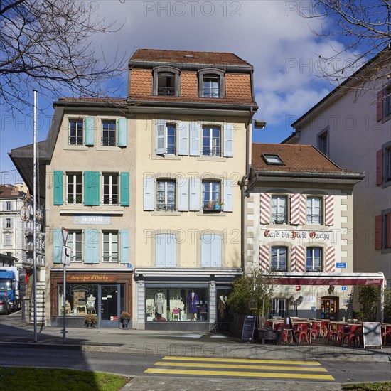 Old pastel-coloured houses with white windows and wooden shutters and the Cafe Vieil Ouchy in the Ouchy district, Lausanne, district of Lausanne, Vaud, Switzerland, Europe