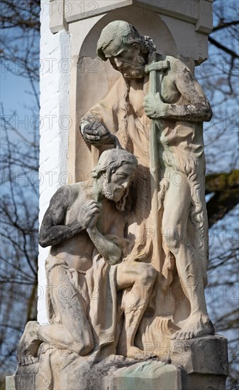 Stone statue made in 1912 by Franz Hoser (1874-1957), St John the Baptist baptising JESUS, next to the Holy Trinity Church in the Mainkofen District Hospital, Bavaria, Germany, Europe