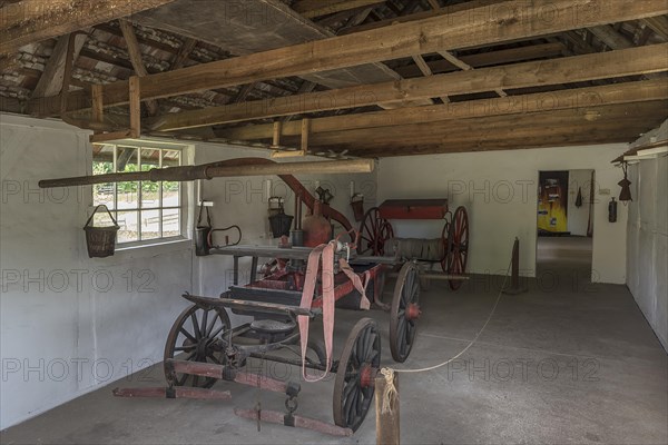 Fire engine in a fire engine house around 1900, was pulled by horses, open-air museum for folklore Schwerin-Muess, Mecklenburg-Vorpommerm, Germany, Europe