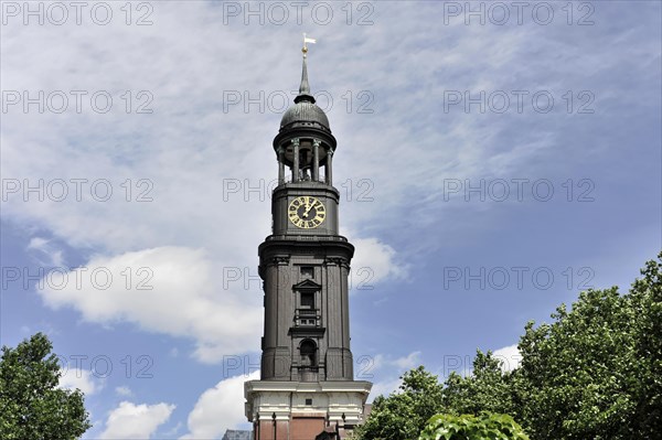Michaeliskirche, Michel, baroque church St. Michaelis, first start of construction 1647- 1750, tower clock on a historic building under a blue sky, Hamburg, Hanseatic City of Hamburg, Germany, Europe