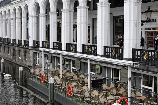 A cafe with an outdoor terrace next to a body of water in an urban area, Hamburg, Hanseatic City of Hamburg, Germany, Europe