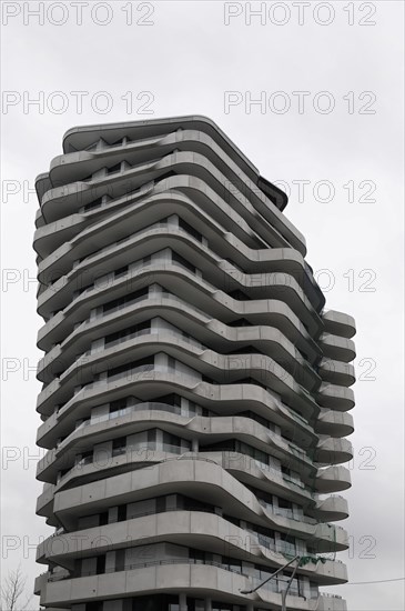 Marco Polo Tower, A unique wave-shaped modern building under a cloudy sky, Hamburg, Hanseatic City of Hamburg, Germany, Europe