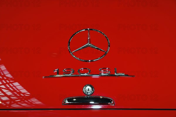 RETRO CLASSICS 2010, Stuttgart Trade Fair, close-up of the Mercedes-Benz logo and 190 SL emblem on red classic car bodywork, Stuttgart Trade Fair, Stuttgart, Baden-Wuerttemberg, Germany, Europe