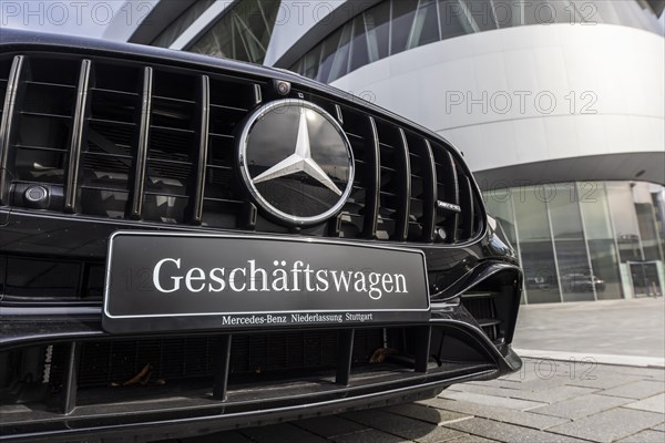 Mercedes company car, radiator grille and Mercedes star on a modern vehicle, in the background the Mercedes-Benz Museum, Baden-Wuerttemberg, Germany, Europe