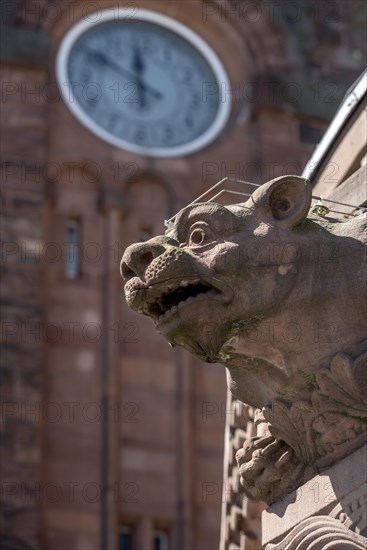 Gargoyle, demonic animal figure on the pavilion, clock from the clock tower, historic Wilhelmine railway station, red sandstone, sculpture, neo-Romanesque and Art Nouveau, cultural monument, listed building, Giessen, Giessen, Hesse, Germany, Europe