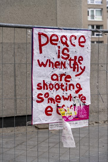 Symbolic photo, poster on a construction fence, Berlin, Germany, Europe