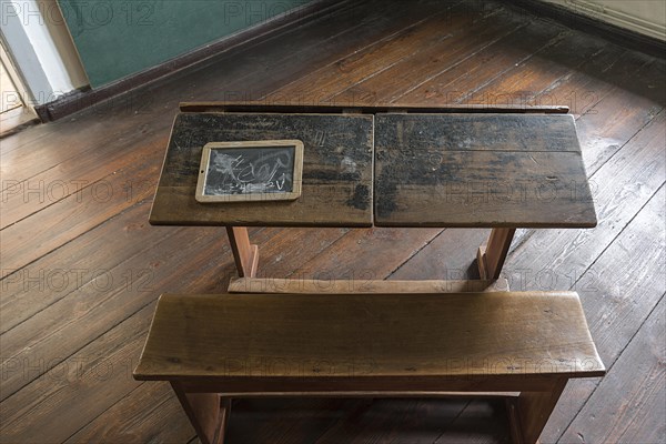 School desk with slate board in a 19th century classroom, Open-Air Museum of Folklore Schwerin-Muess, Mecklenburg-Western Pomerania, Germany, Europe