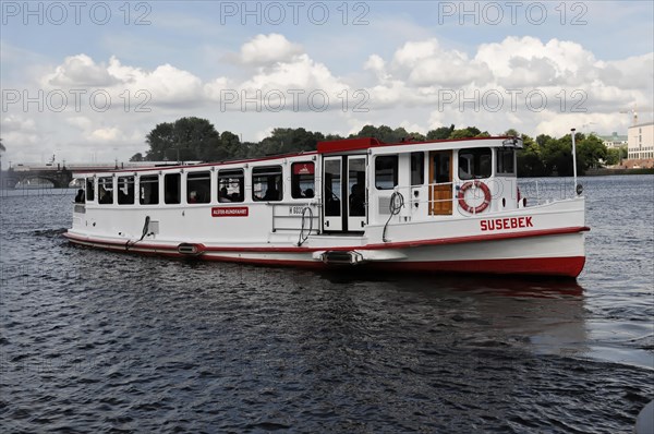A small excursion boat sailing on the Alster, Hamburg, Hanseatic City of Hamburg, Germany, Europe