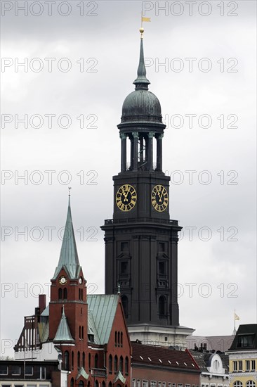Landmark, Hamburg Michel, Baroque church St. Michaelis, A large church tower with clocks and a pointed roof under a grey sky, Hamburg, Hanseatic city of Hamburg, Germany, Europe