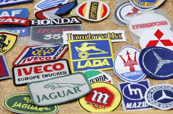 RETRO CLASSICS 2010, Stuttgart Messe, Collection of different colourful patches with car brand logos on a table, Stuttgart Messe, Stuttgart, Baden-Wuerttemberg, Germany, Europe