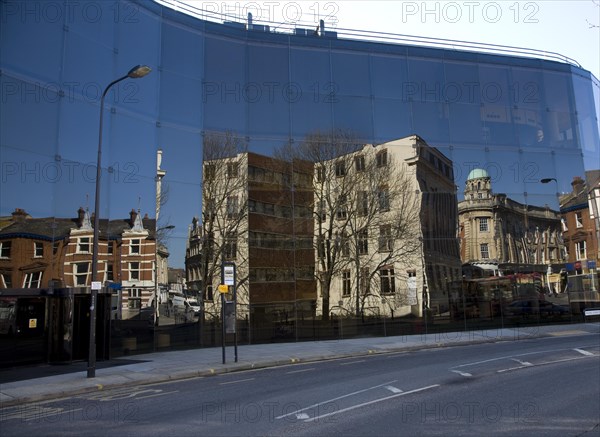 Buildings reflected in glass of award winning Willis Corroon building, architect Norman Foster, Ipswich, Suffolk, England, UK