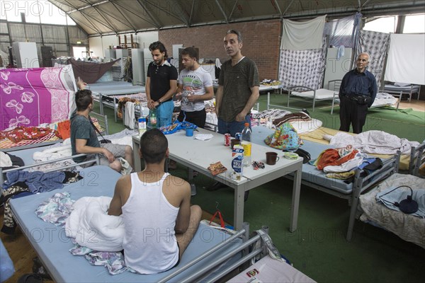 Refugees from Syria are housed in a gymnasium at the central contact point for asylum seekers in Brandenburg, 03/06/2015