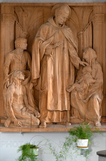 Mainkofen, Lower Bavaria, Germany, March 15th 2024, wood carving of Franz Hoser (1874-1957) in the Trinity Church, Dreifaltigkeitskirche in Mainkofen, Saint John of God, founder of the order of the Brothers Hospitallers, Barmherzige Brueder, Europe