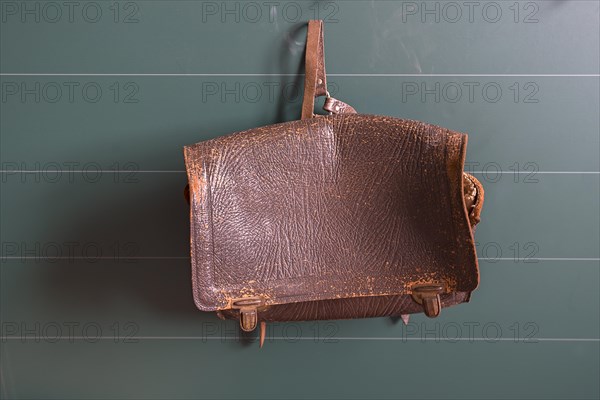 Leather school bag hanging in a classroom from the 19th century, Open-Air Museum of Folklore Schwerin-Muess, Mecklenburg-Vorpommerm, Germany, Europe