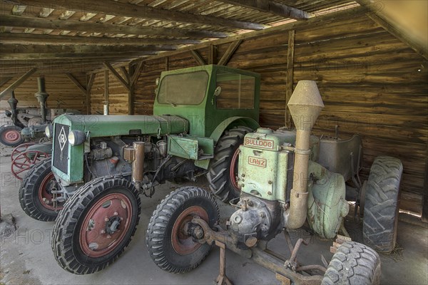 Tractors, on the right a Lanz Bulldog from 1932, in a shelter, Schwerin-Muess Open-Air Museum of Folklore, Mecklenburg-Western Pomerania, Germany, Europe