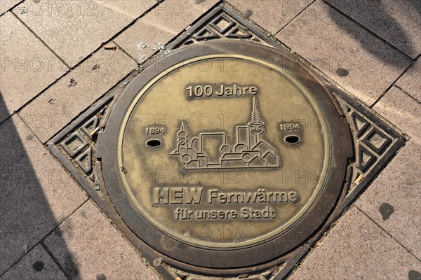 Commemorative plaque on the pavement celebrates 100 years of district heating in Hamburg, Hamburg, Hanseatic City of Hamburg, Germany, Europe