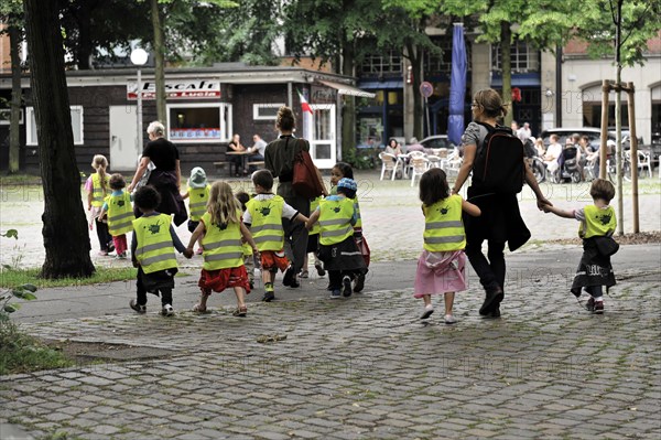 Toddlers in high-visibility waistcoats walking in a pedestrian zone, Hamburg, Hanseatic City of Hamburg, Germany, Europe
