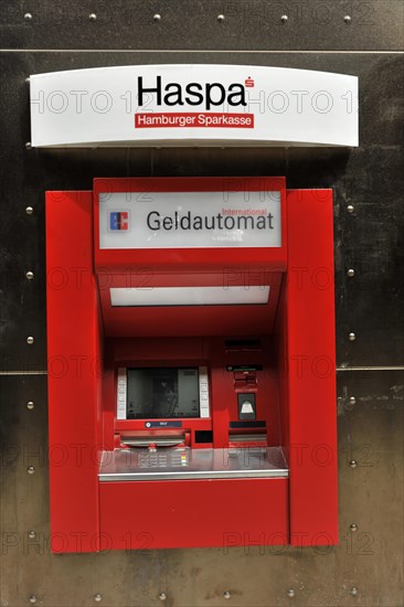 A red Haspa ATM embedded in a wall with a secure appearance, Hamburg, Hanseatic City of Hamburg, Germany, Europe