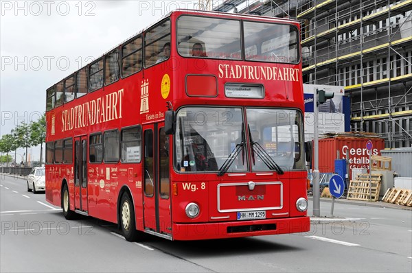 A red double-decker bus for sightseeing on a street in Hamburg, Hamburg, Hanseatic City of Hamburg, Germany, Europe
