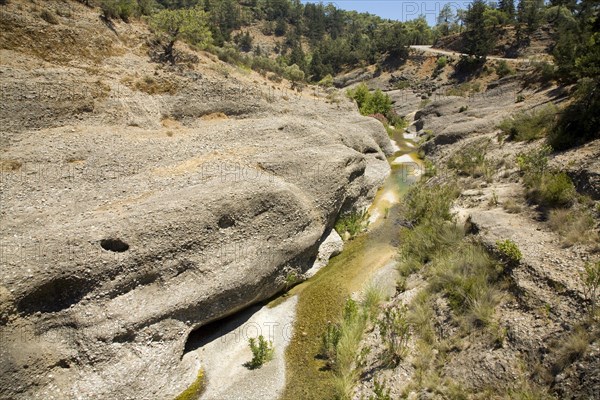 River vertical erosion through conglomerate rock beds, Rhodes, Greece, Europe