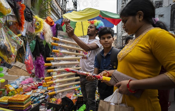 Vendor sells Holi celebration items in a street market, ahead of Holi festival on March 23, 2024 in Guwahati, Assam, India. Holi is the Hindu festival of colours, it is celebrated with great joy in India