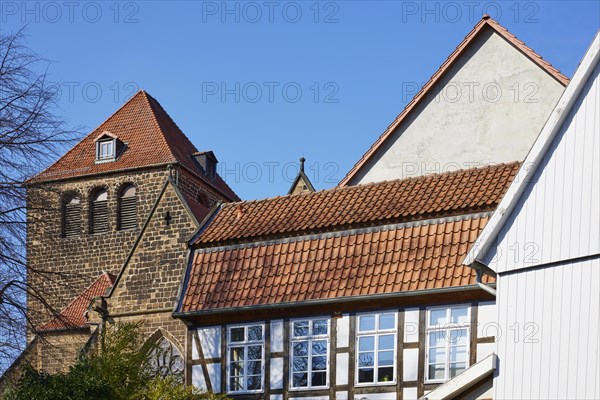Roof of a half-timbered house, gable and tower of St Martini's Church in Minden, Muehlenkreis Minden-Luebbecke, North Rhine-Westphalia, Germany, Europe