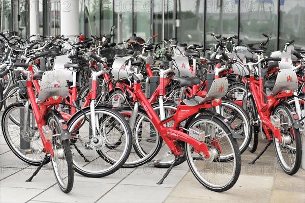 Row of red rental bicycles parked at an outdoor bicycle stand, Hamburg, Hanseatic City of Hamburg, Germany, Europe