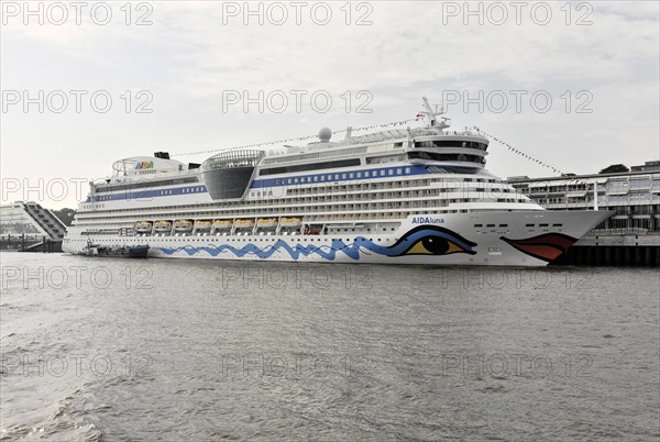 AIDAluna, cruise ship, year of construction 2009, 251, 89m long, The cruise ship AIDAblu lies in the harbour, surrounded by water and a cloudy sky, Hamburg, Hanseatic City of Hamburg, Germany, Europe