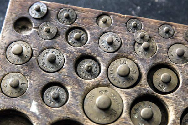 Weights for a pharmacist's precision balance in the historic Berg Pharmacy in Clausthal-Zellerfeld. The current Berg-Apotheke, one of the oldest pharmacies in Germany, was built in 1674, 09.11.2015