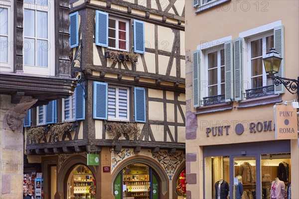 Pastel-coloured facades of historic half-timbered houses with white windows and colourful wooden shutters in the old town of Colmar, Department Haut-Rhin, Grand Est, France, Europe