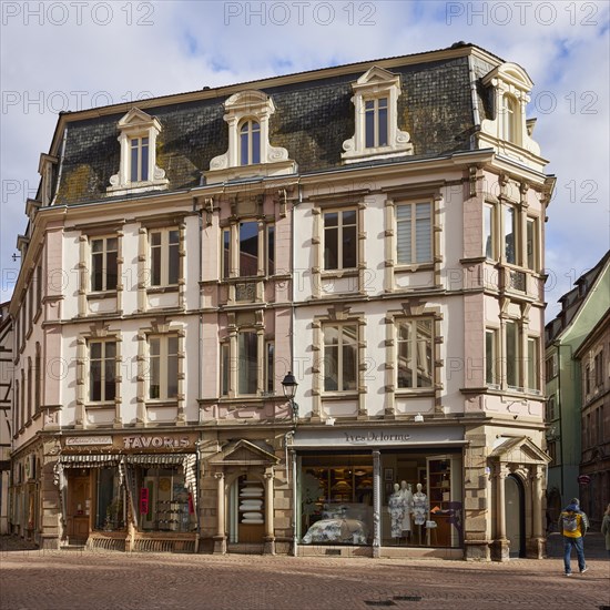 Historic residential and commercial building with retail shops in the historic centre of Colmar, Department Haut-Rhin, Grand Est, France, Europe