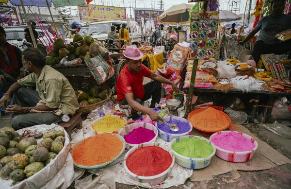 Vendor sells Holi celebration items in a street market, ahead of Holi festival on March 23, 2024 in Guwahati, Assam, India. Holi is the Hindu festival of colours, it is celebrated with great joy in India