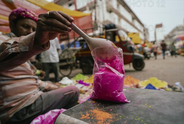 Vendor sells Holi celebration items in a street market, ahead of Holi festival on March 23, 2024 in Guwahati, Assam, India. Holi is the Hindu festival of colours, it is celebrated with great joy in India