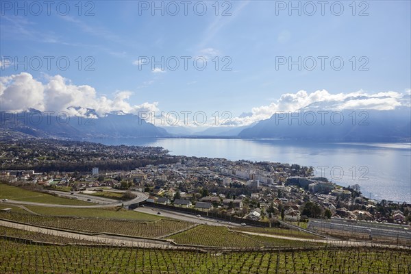 Main road 12 leads through the UNESCO World Heritage vineyard terraces of Lavaux with views of Vevey and Lake Geneva from the Jongny site, Riviera-Pays-d'Enhaut district, Vaud, Switzerland, Europe