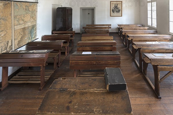 Classroom with school desks and teacher's desk from the 19th century, behind a photograph of Tsar Alexander III from 1881, Open-Air Museum of Folklore Schwerin-Muess, Mecklenburg-Western Pomerania, Germany, Europe