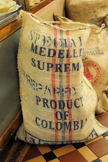 Coffee, A rustic sack labelled 'Medellin Supreme Product of Colombia' presumably for coffee beans, Hamburg, Hanseatic City of Hamburg, Germany, Europe