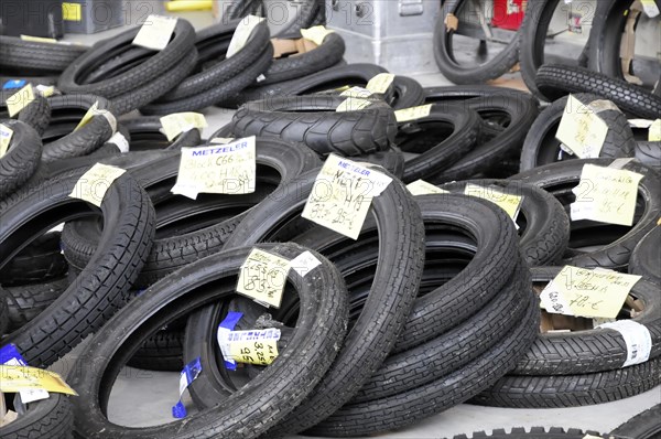 RETRO CLASSICS 2010, Stuttgart Messe, pile of black motorbike tyres of different sizes with price labels, Stuttgart Messe, Stuttgart, Baden-Wuerttemberg, Germany, Europe