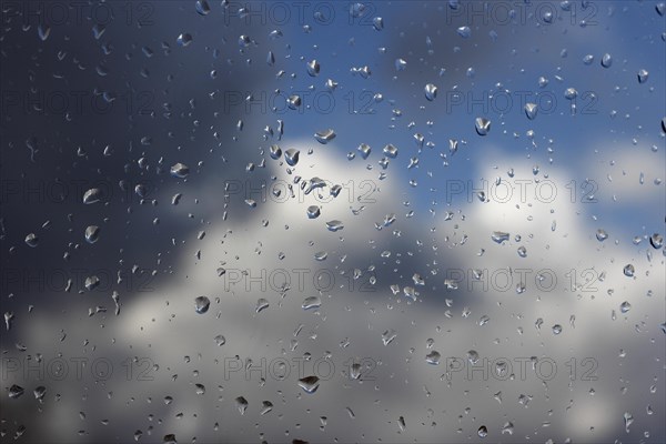 Raindrops on a window pane, North Rhine-Westphalia, Germany, Europe