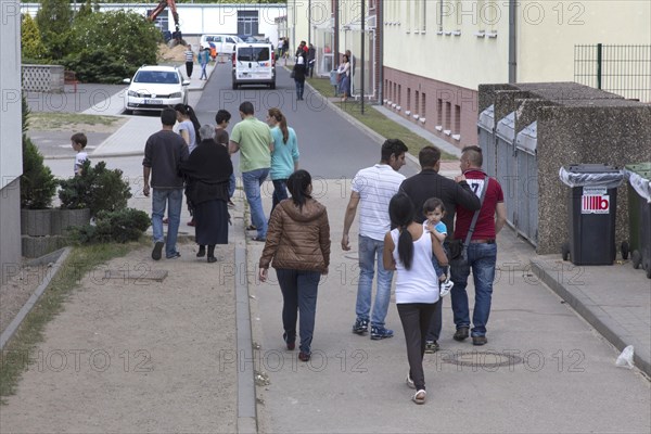 Refugees at the central contact point for asylum seekers in Brandenburg, Eisenhuettenstadt, 3 June 2015