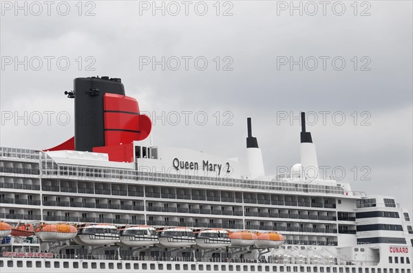 Close-up of a cruise ship smokestack Queen Mary 2, with orange lifeboats, Hamburg, Hanseatic City of Hamburg, Germany, Europe