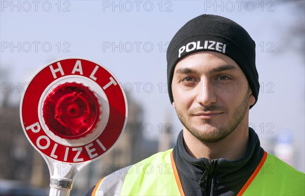 Berlin police officer with a police trowel during a traffic stop, 20/03/2015
